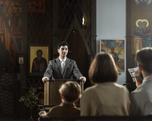 medium-shot-young-pastor-preaching-church